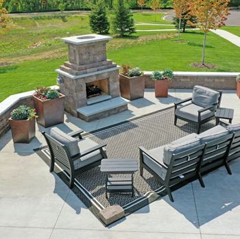 Outdoor courtyard with fire pit at Cedar Green, Blaine, MN